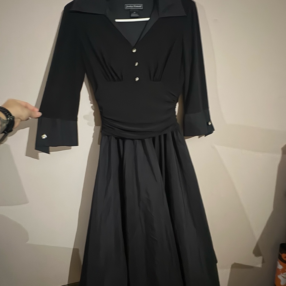 Vintage Elegant Black Dress with Cinched Waist, Flair Skirt, and Button Accents